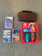 Nintendo switch oled with games (New Condition) 9C65