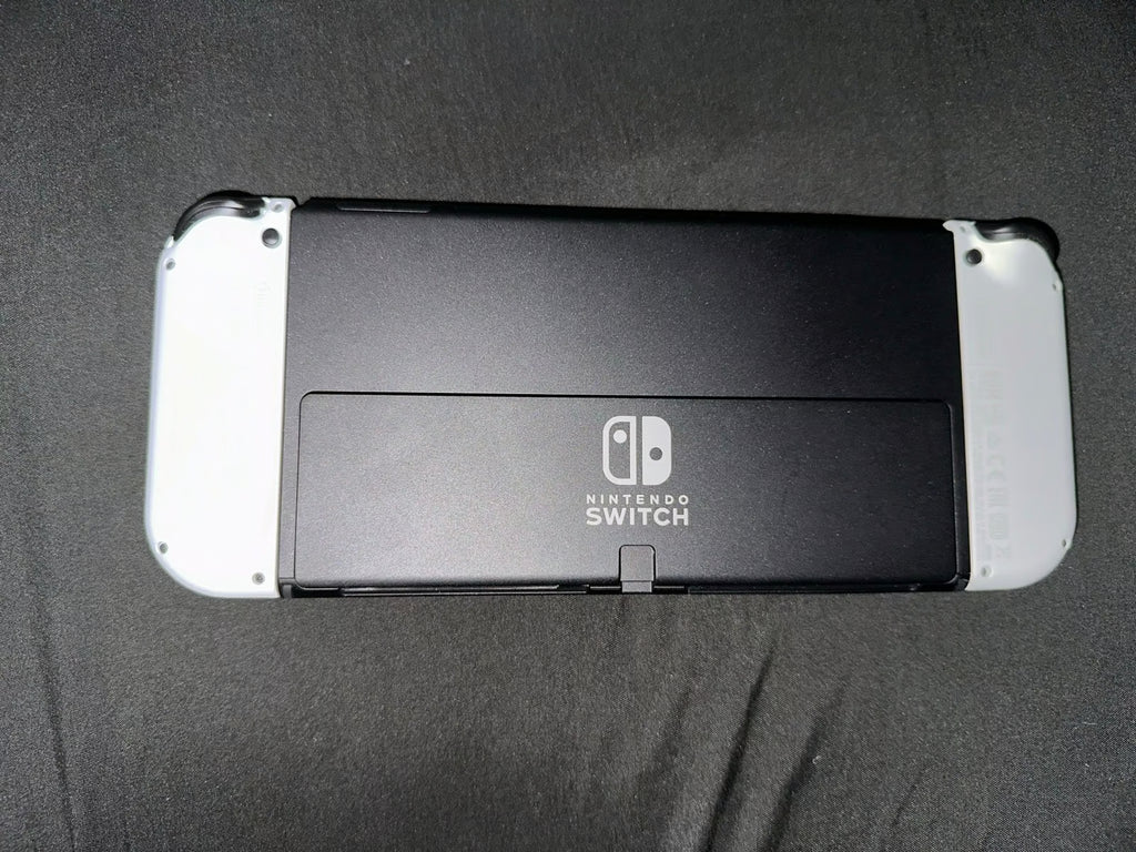 Nintendo Switch Oled White Comes With Mario Strikers and Ring Fit Adventure 9J58