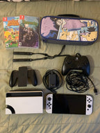 Barely used Nintendo Switch OLED with games travel case and extra controller 3K57