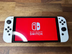 Nintendo Switch OLED 64GB + 128GB SD Handheld Console w/Joy-Con White & 5 Games 7K32