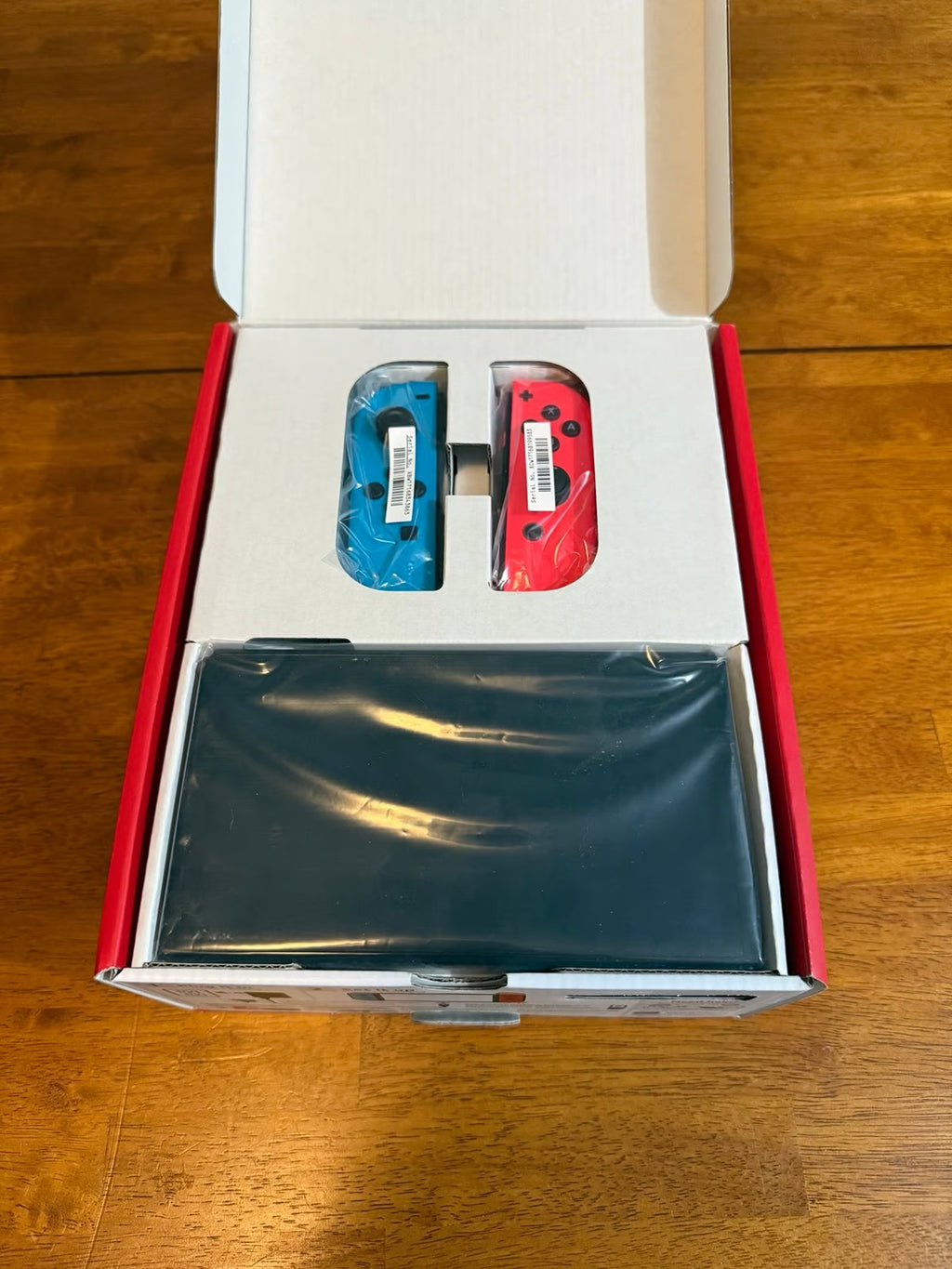 Nintendo Switch OLED Neon Red and Blue 7O21