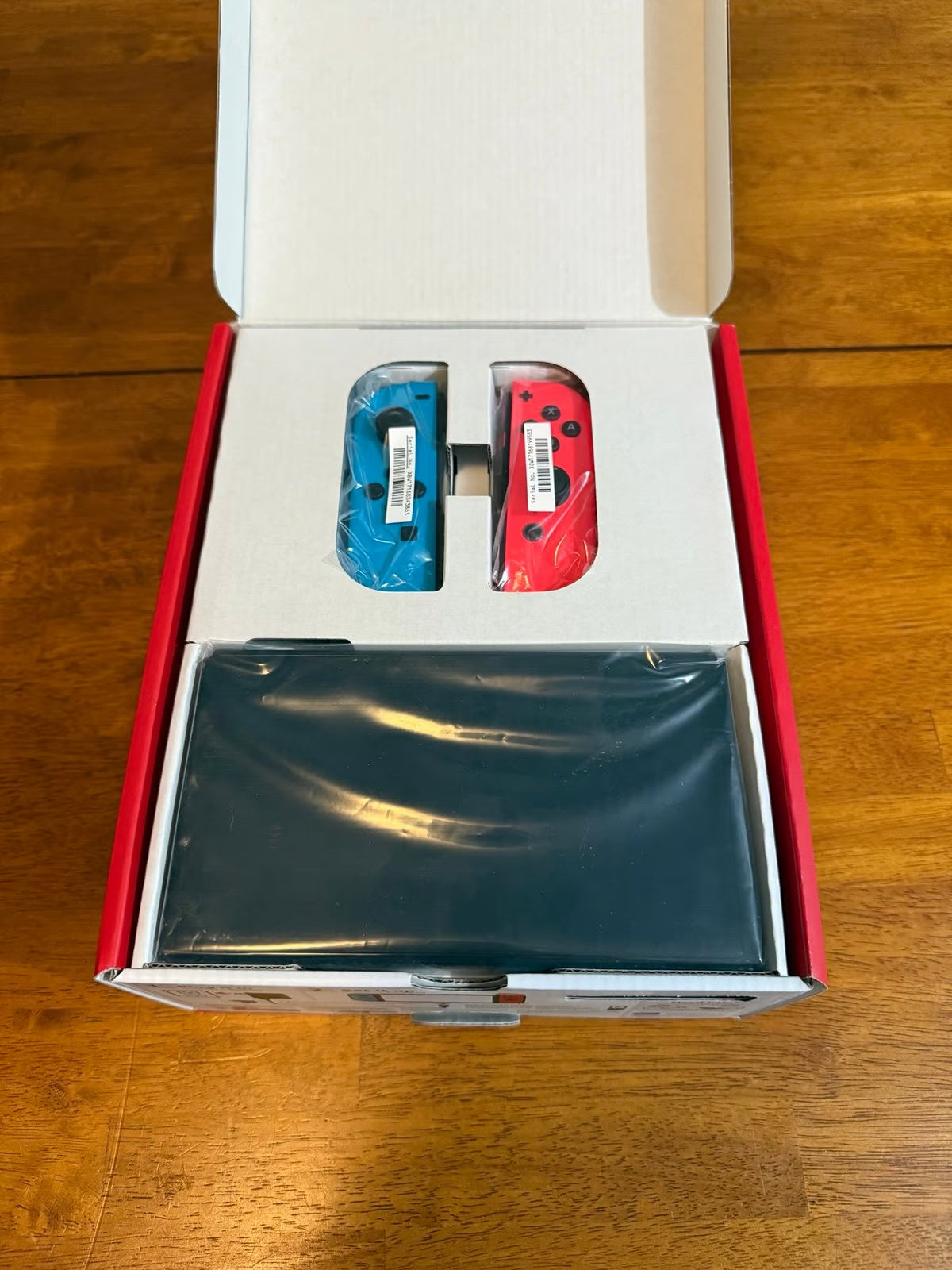 Nintendo Switch OLED Neon Red and Blue 7O21