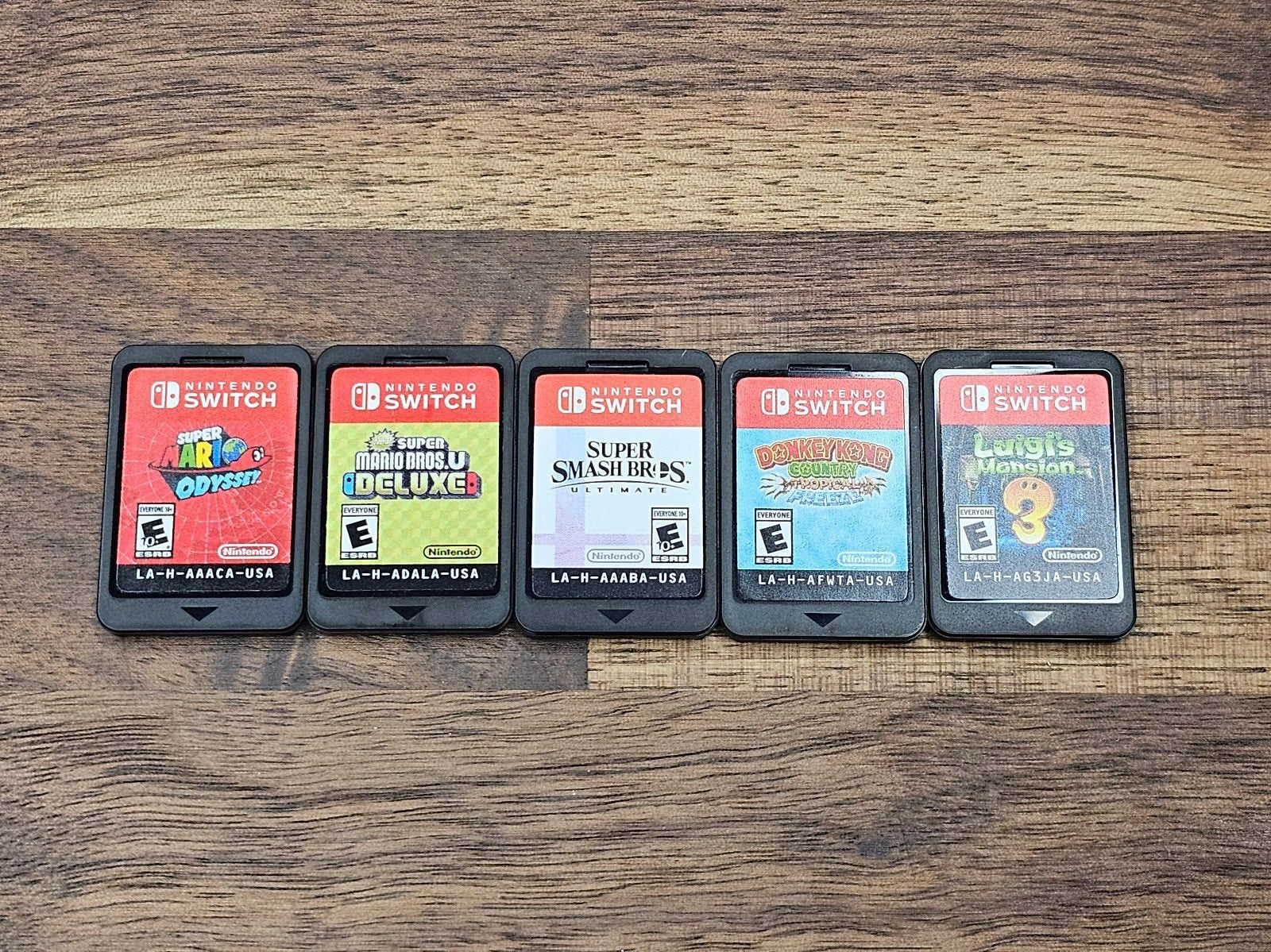 Nintendo Switch OLED 64GB + 128GB SD Handheld Console w/Joy-Con White & 5 Games 7K32