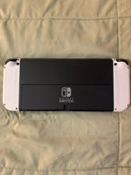 Barely used Nintendo Switch OLED with games travel case and extra controller 3K57