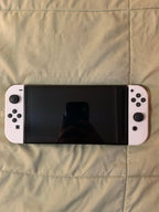 Barely used Nintendo Switch OLED with games travel case and extra controller 3K57