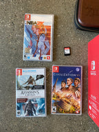 Nintendo switch oled with games (New Condition) 9C65