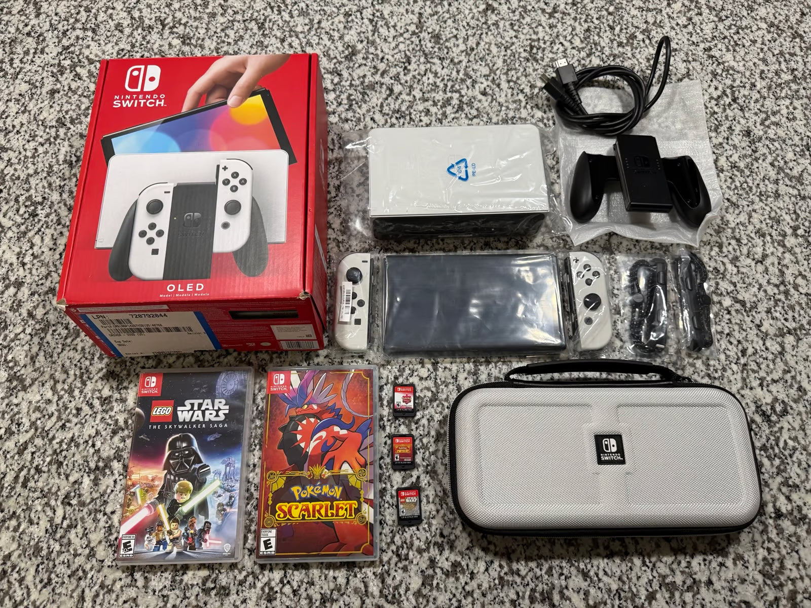 Nintendo Switch OLED + Games + Case 7P83