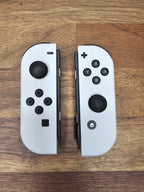 Nintendo Switch OLED 64GB + 128GB SD Handheld Console w/Joy-Con White & 5 Games 7K32