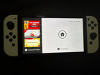 Nintendo Switch Oled White Comes With Mario Strikers and Ring Fit Adventure 9J58