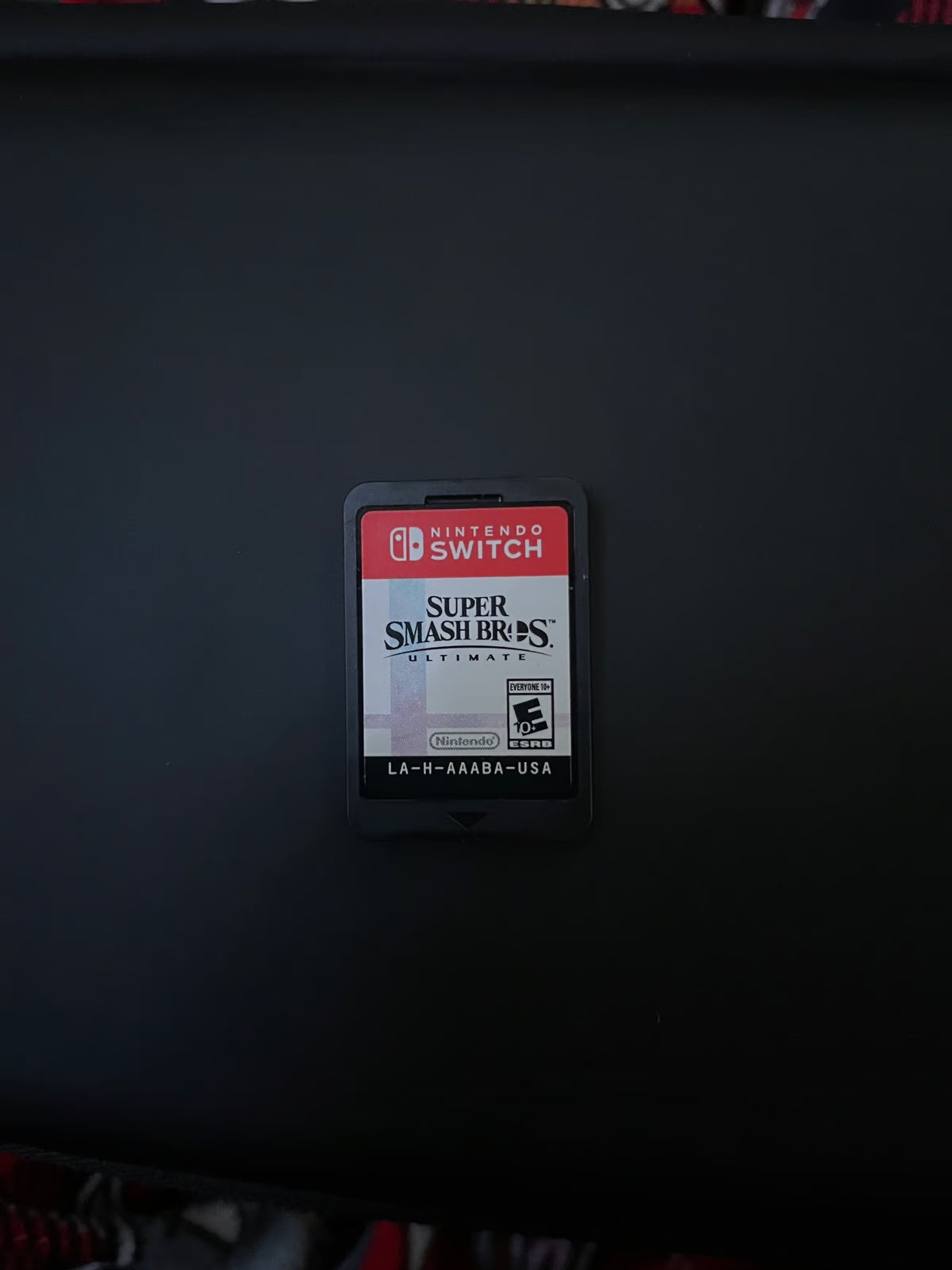 Nintendo Switch OLED with super smash bros and case 2S76