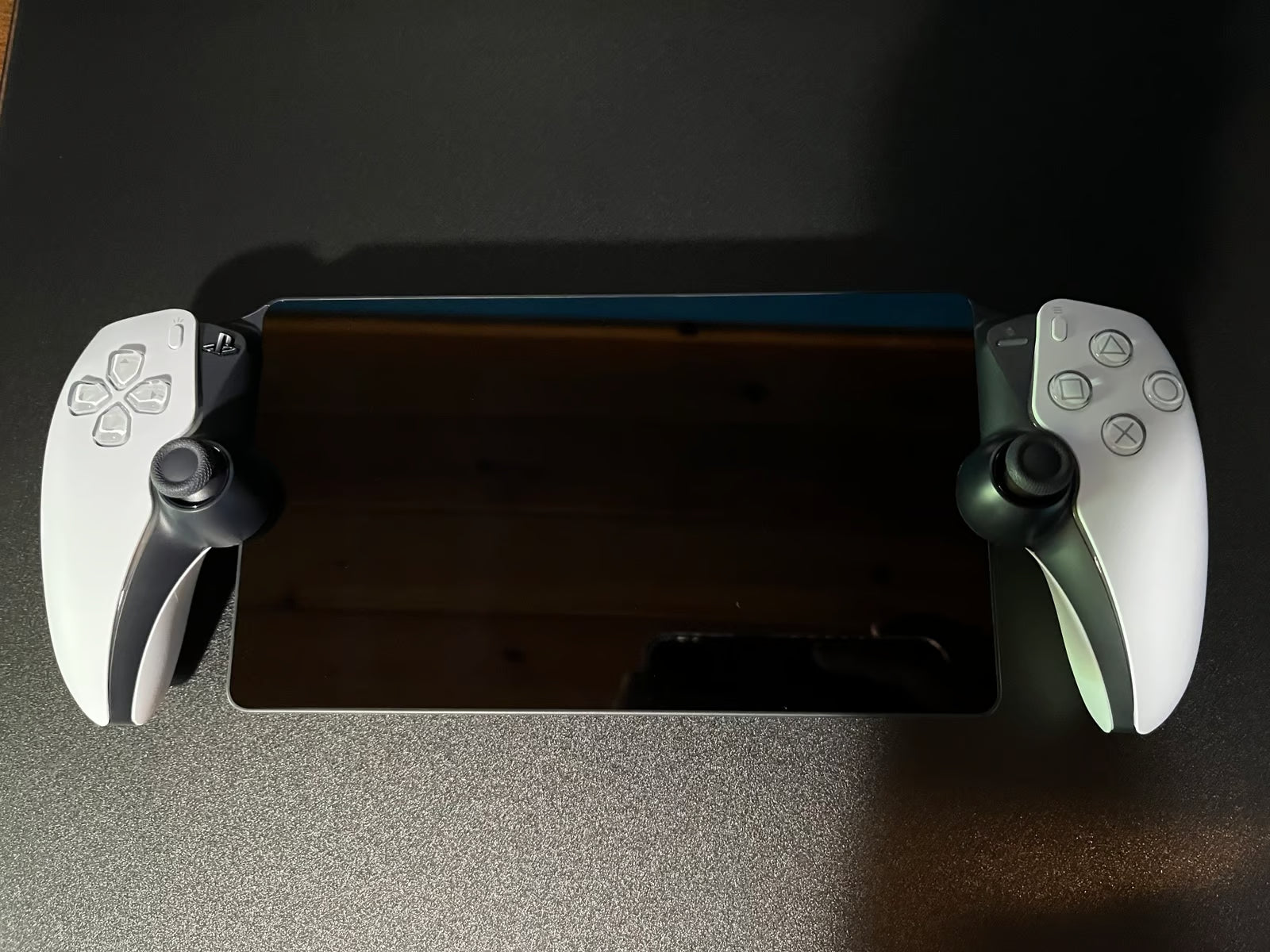 PlayStation Portal with case and earbuds 2T83