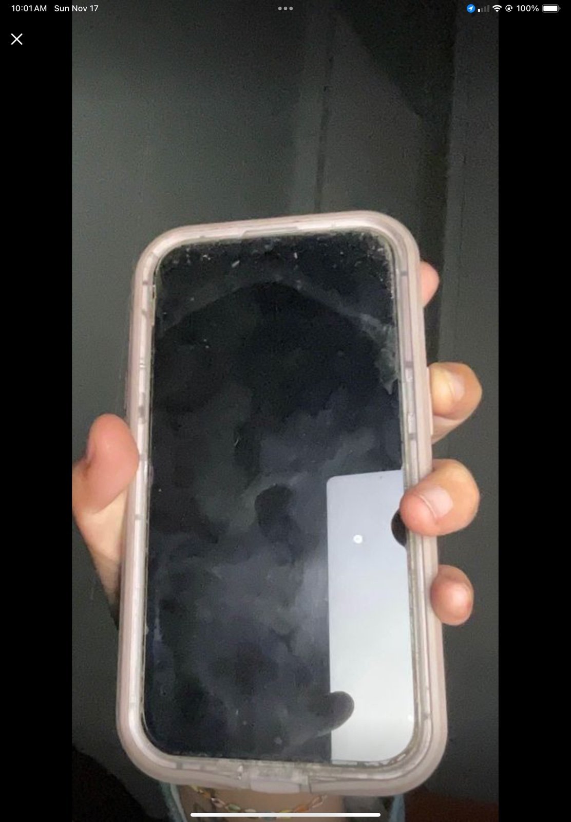 Unlocked blue IPhone 15 with pink wireless charging otter box case 8Y38