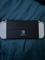 Nintendo Switch OLED with super smash bros and case 2S76