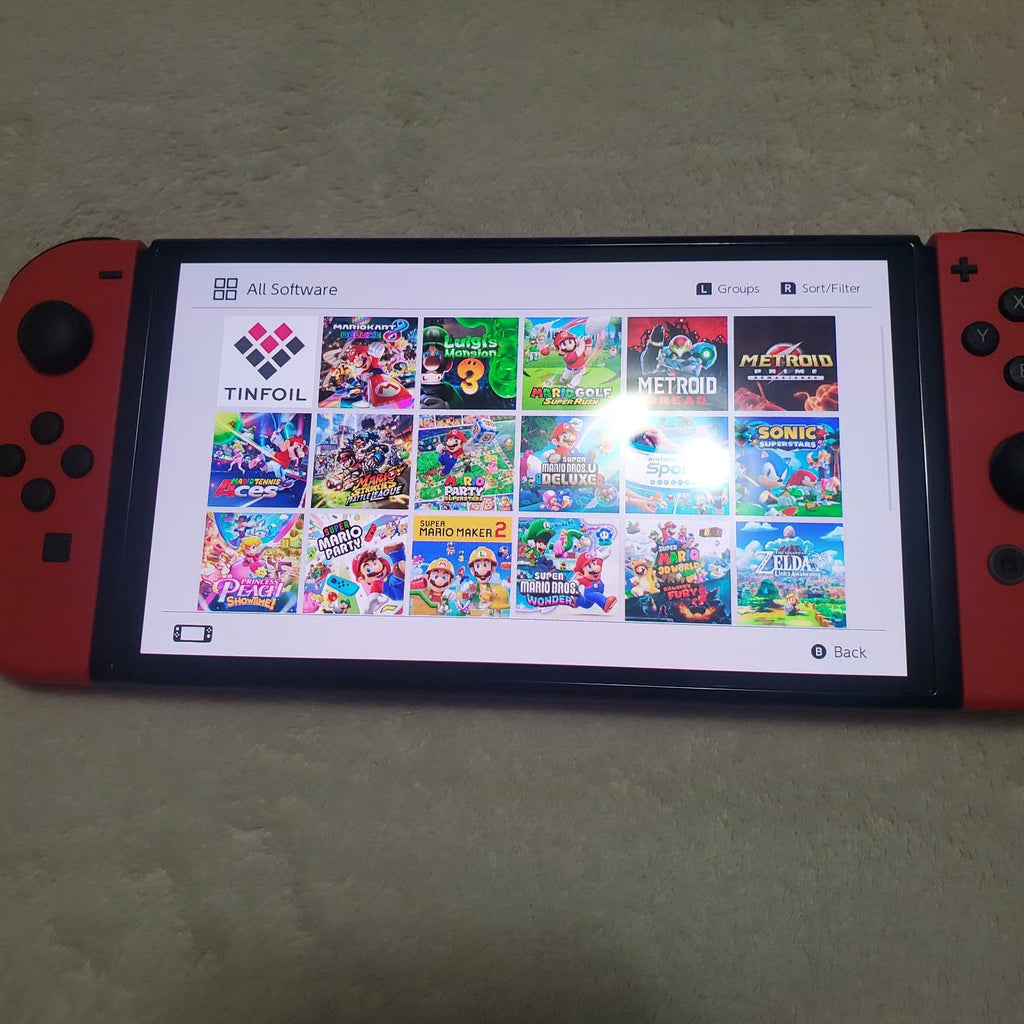 Nintendo switch oled mario with hekate rp-2040 128gb memory and all games free 1B21