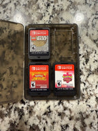 Nintendo Switch OLED + Games + Case 7P83