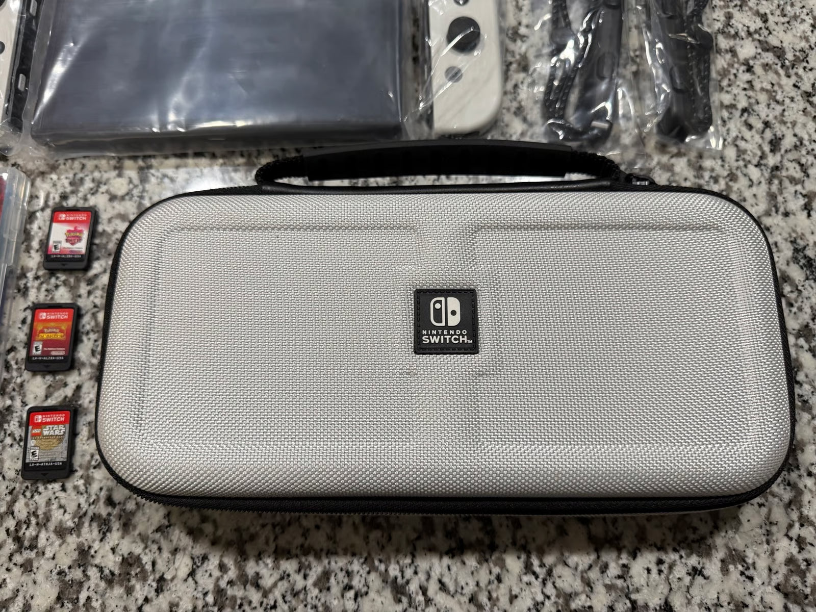 Nintendo Switch OLED + Games + Case 7P83