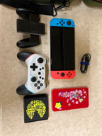 Nintendo switch oled bundle w/2 BRAND NEW WIRELESS CONTROLLERS 2K81